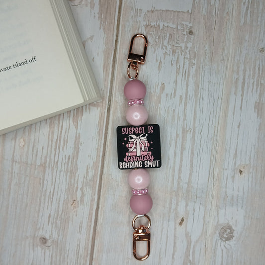 E-Reader/Phone Strap -  Suspect is Definitely Reading Smut (Interchangeable)